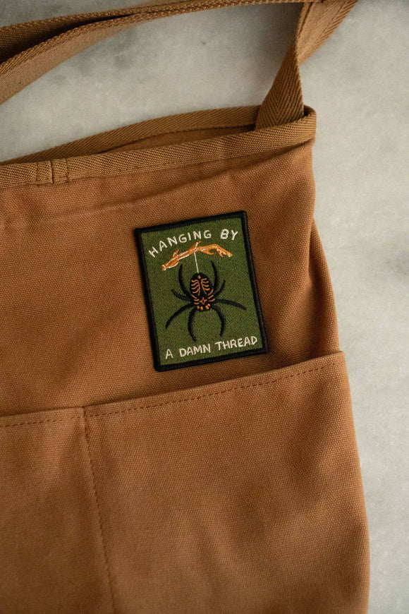 Hanging by a Thread Embroidered Sticky Patch